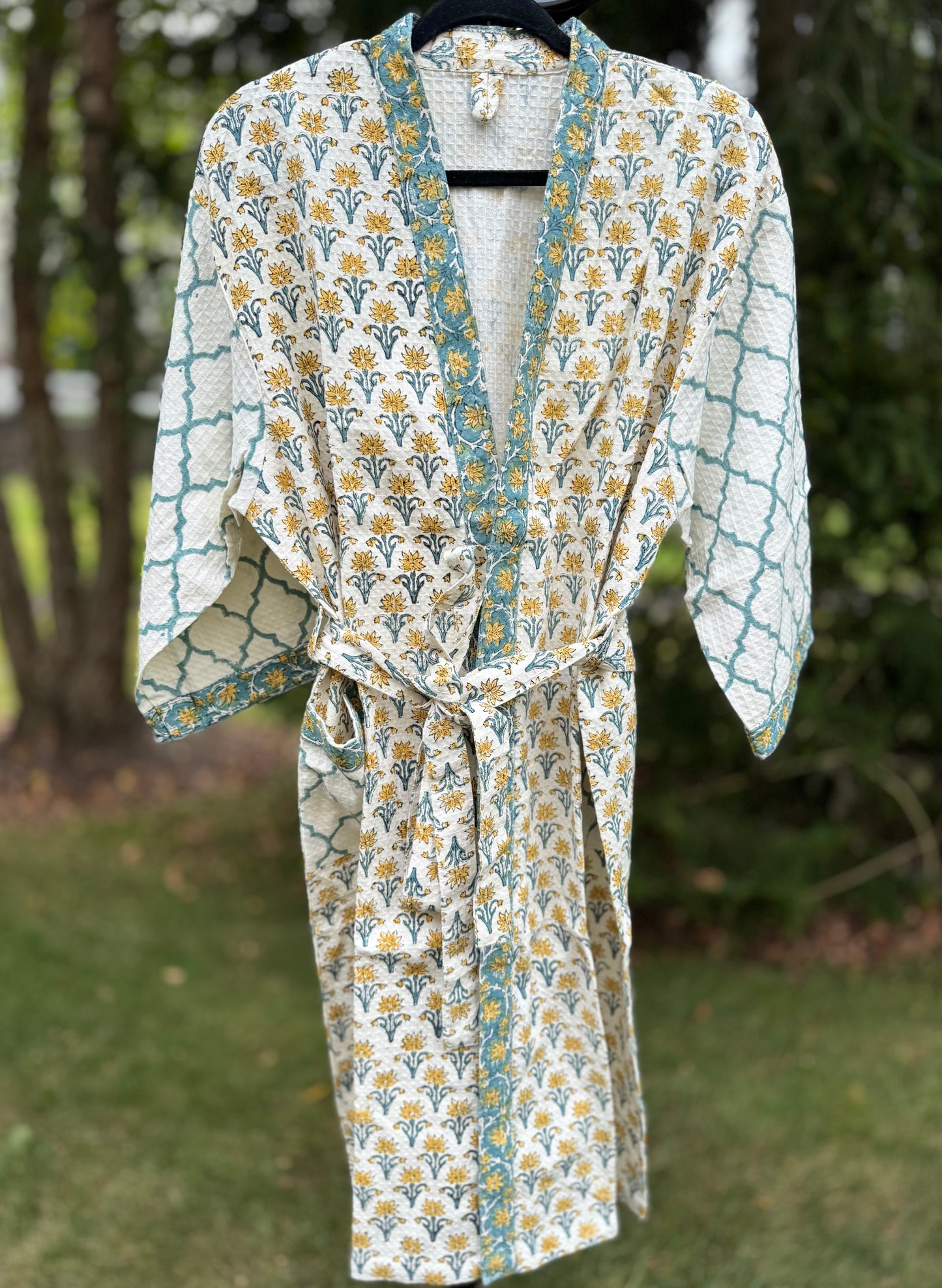 House of Mulmul - cotton bath robe. Floral and geometric patterned robe with yellow flowers and teal blue colors.