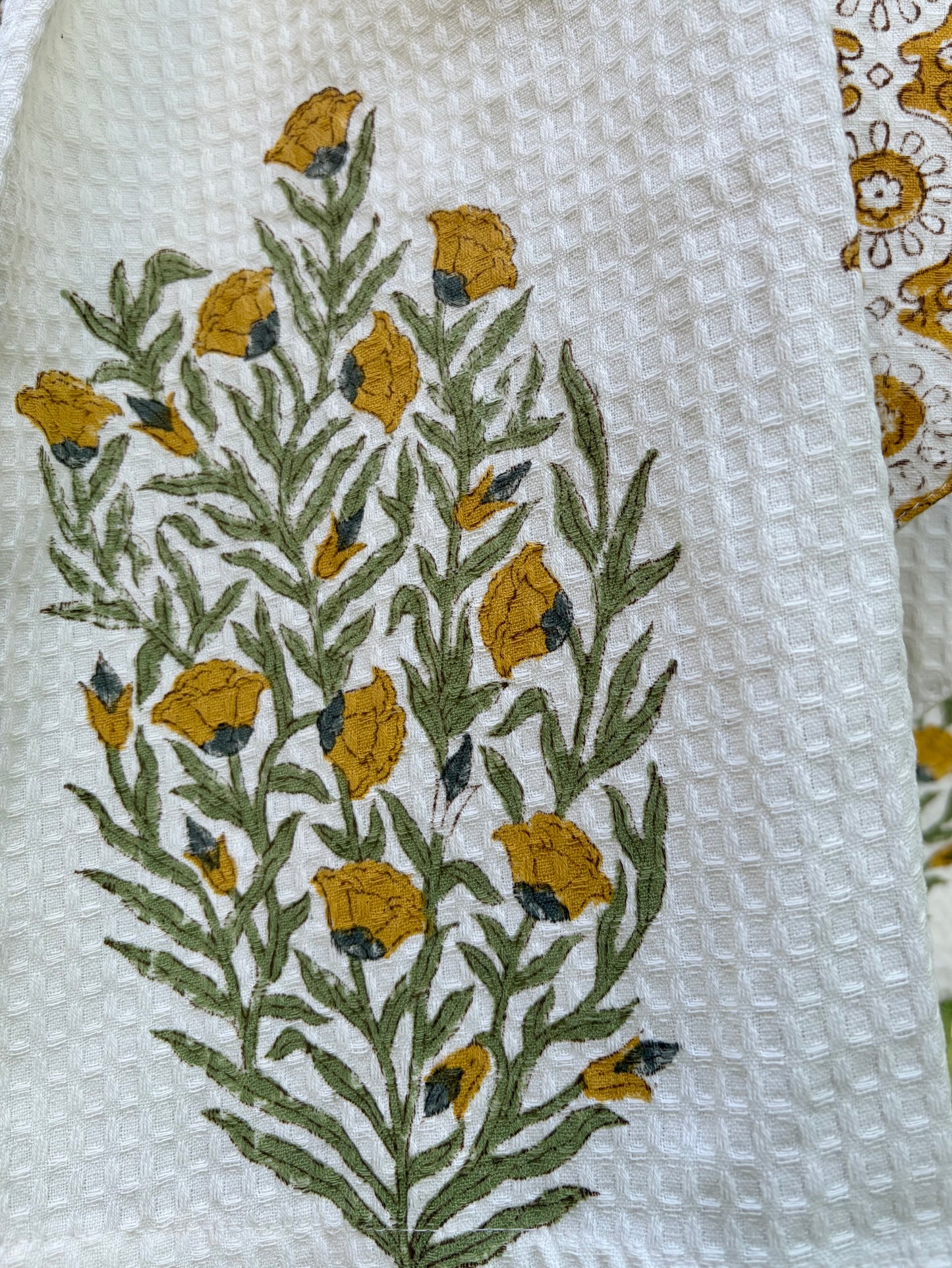 House of Mulmul - Blockprinted Cotton Bathrobe. Blockprinted bathrobe with yellow flowers and green leaves on a white background
