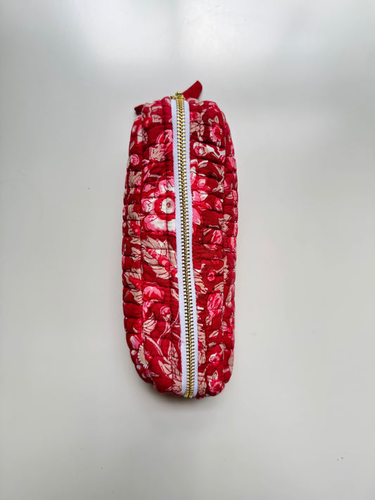 House of Mulmul - Cotton Quilted Makeup Barrel Pouch. A red floral patterned zippered pouch with a gold zipper, photographed against a plain light gray background.
