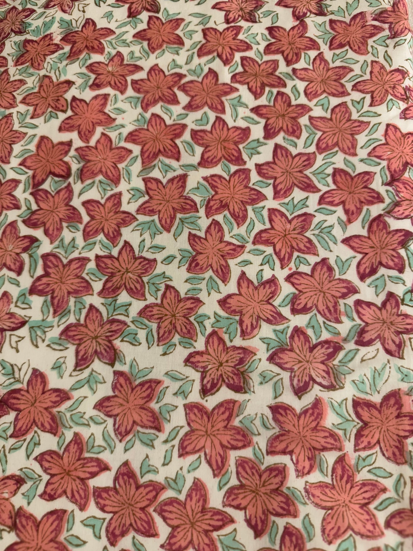 House of Mulmul - Coverlet Dohar, cotton blanket, muslin blanket, mulmul dohar. Pattern of red flowers with green leaves on a beige background