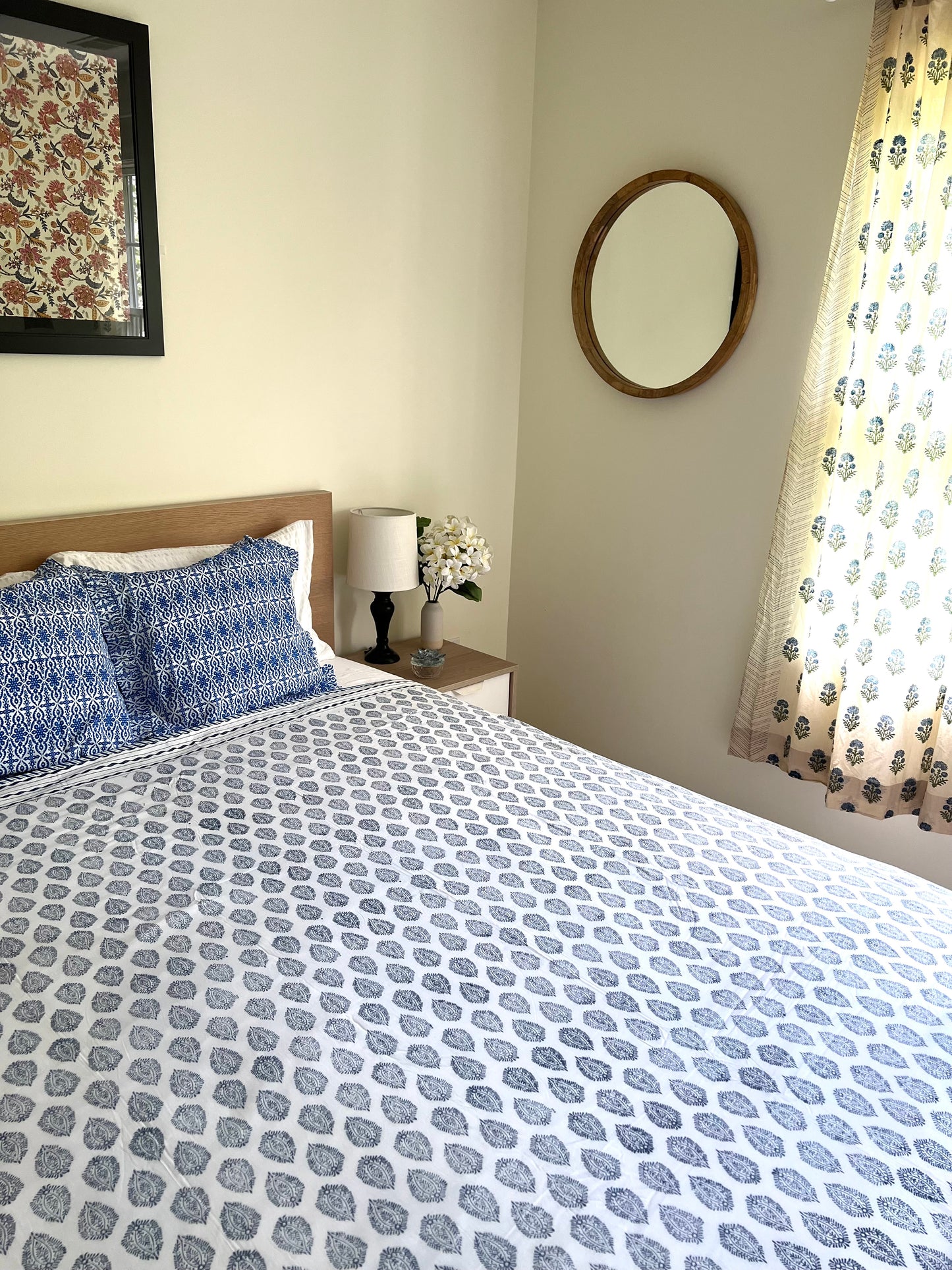 House of Mulmul - Cotton Coverlets (Dohar). Bedroom with patterned bedding, pillows, and decor elements.