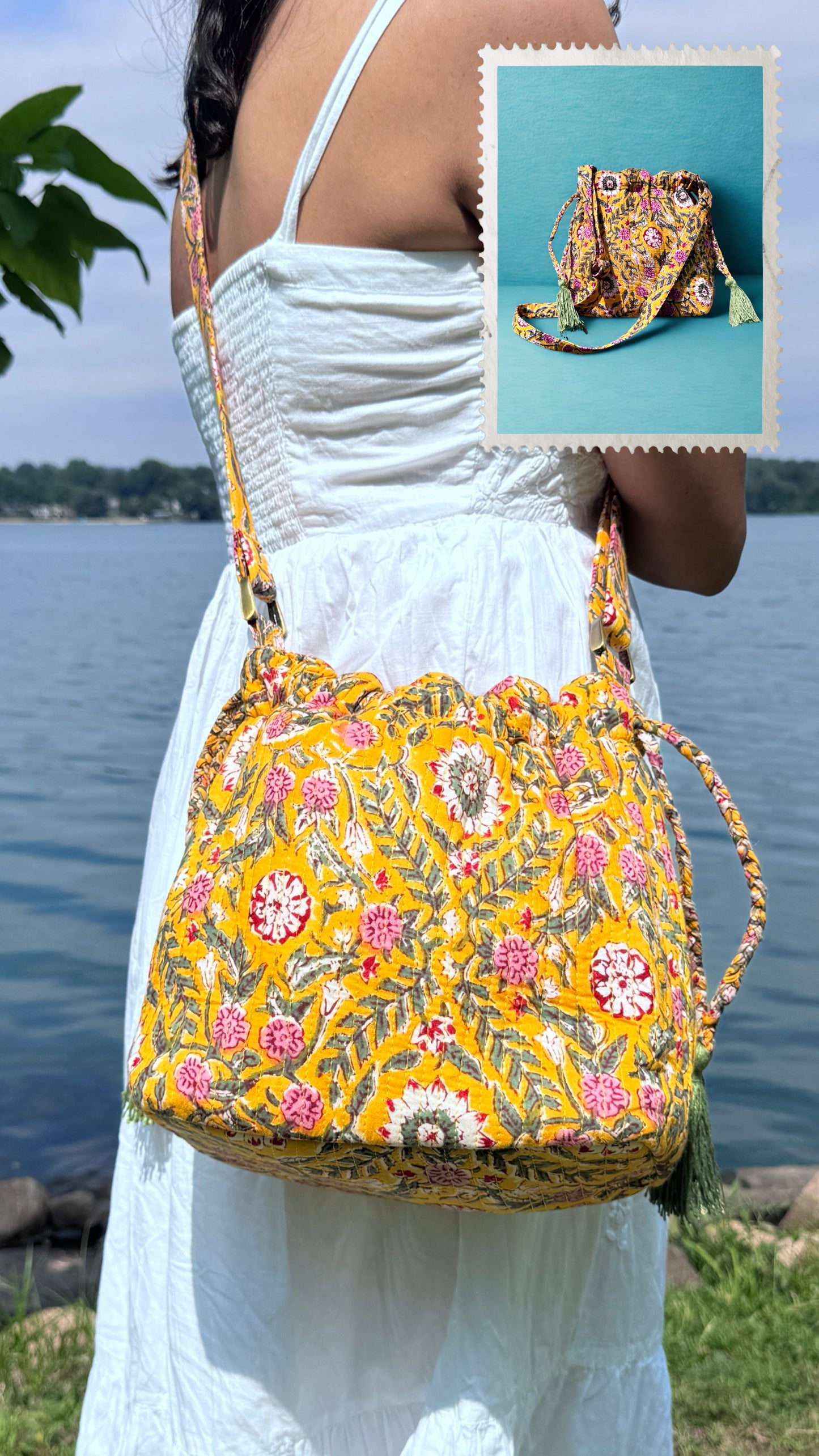 House of Mulmul - Garden Wayfarer Bucket Bag, Cotton bag, Crossbody sling bag. Woman wearing a floral embroidered bag by a body of water