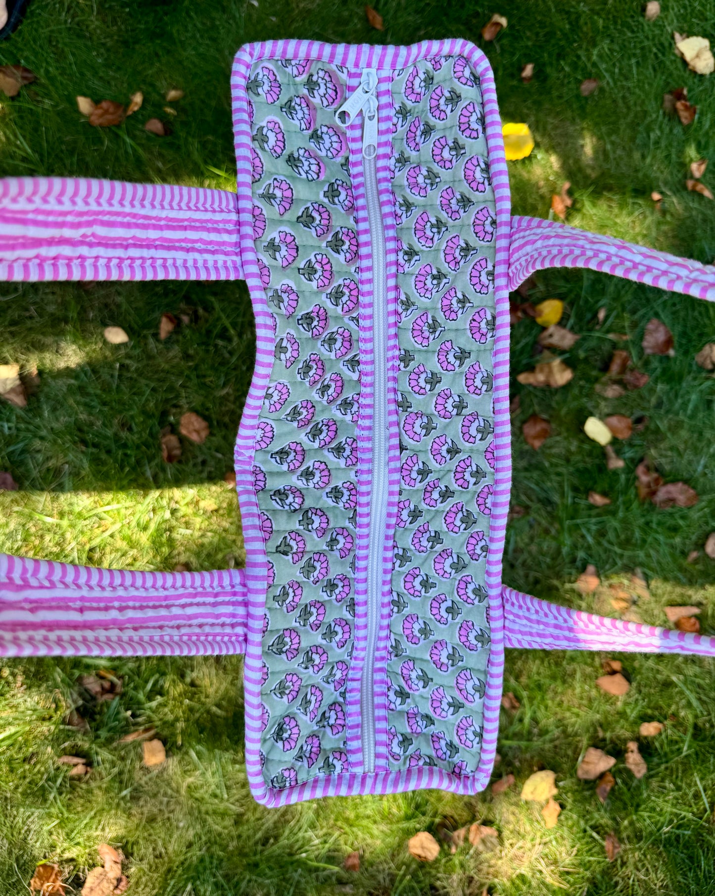 House of Mulmul - Cotton Tote Bag. Fabric straps with paisley pattern on a grassy background