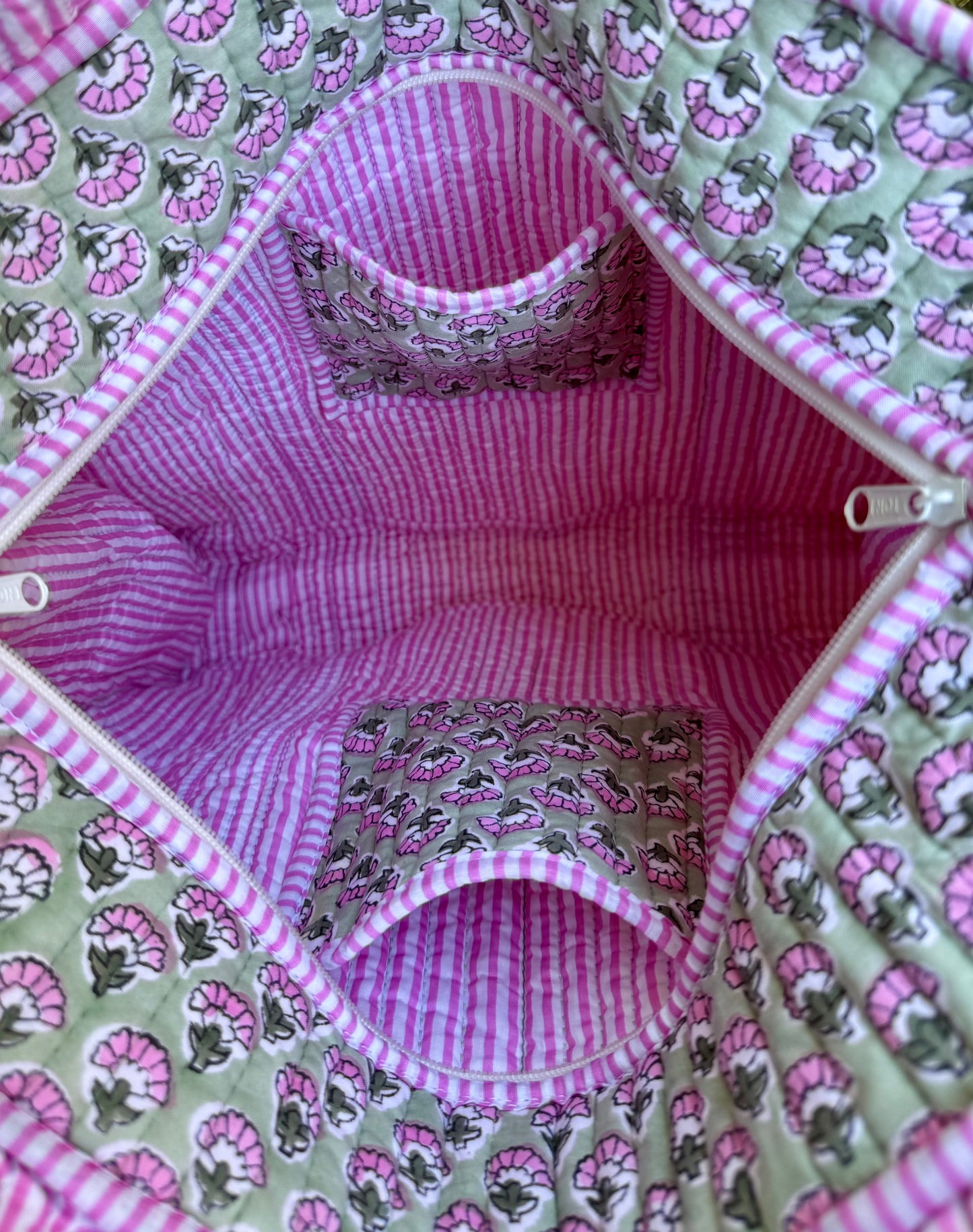 House of Mulmul - Cotton Tote Bag. Close-up of a fabric bag with pink and green patterns