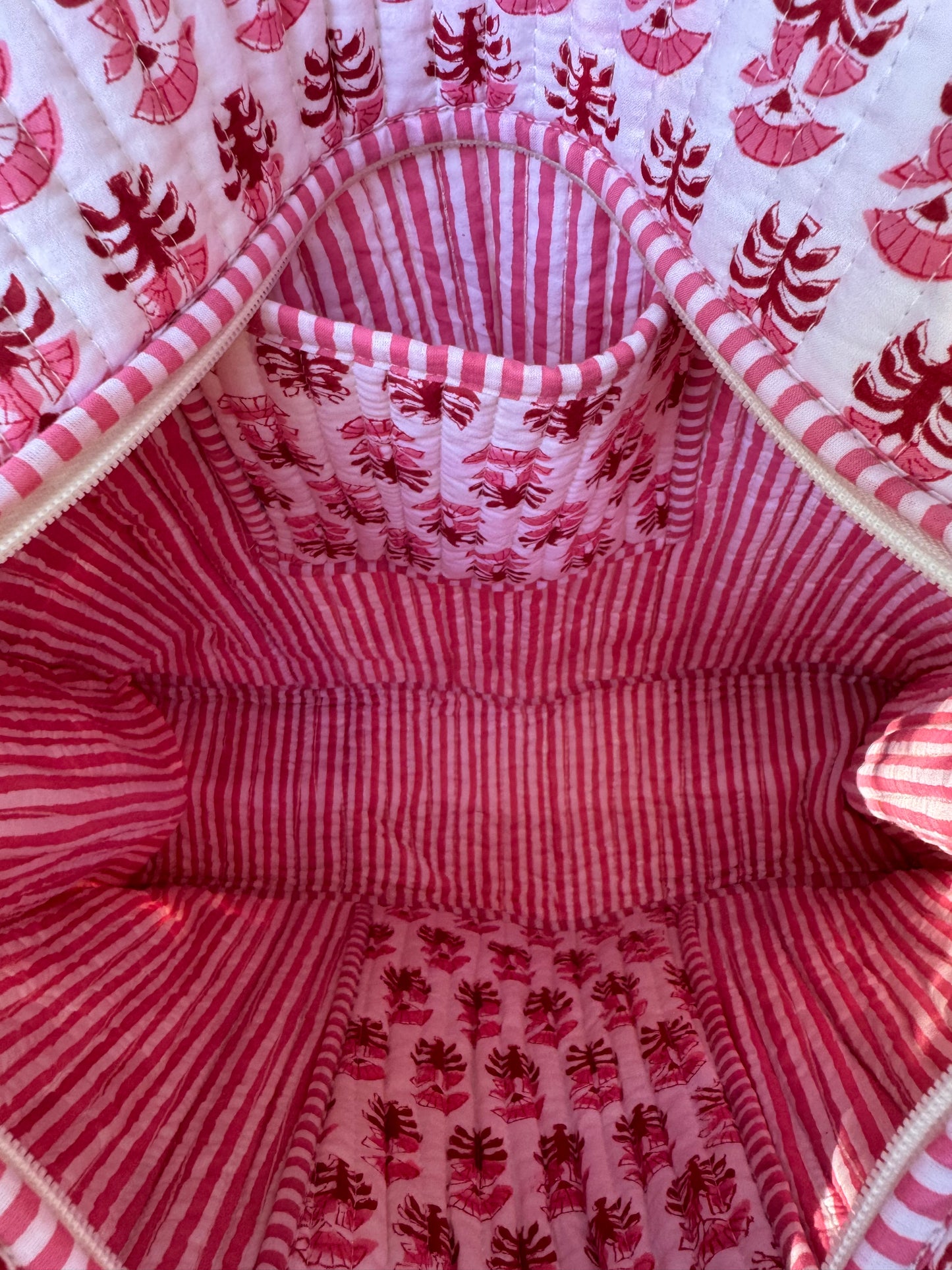 House of Mulmul - Cotton Tote Bag. Close-up of a fabric with pink red and white patterned interior