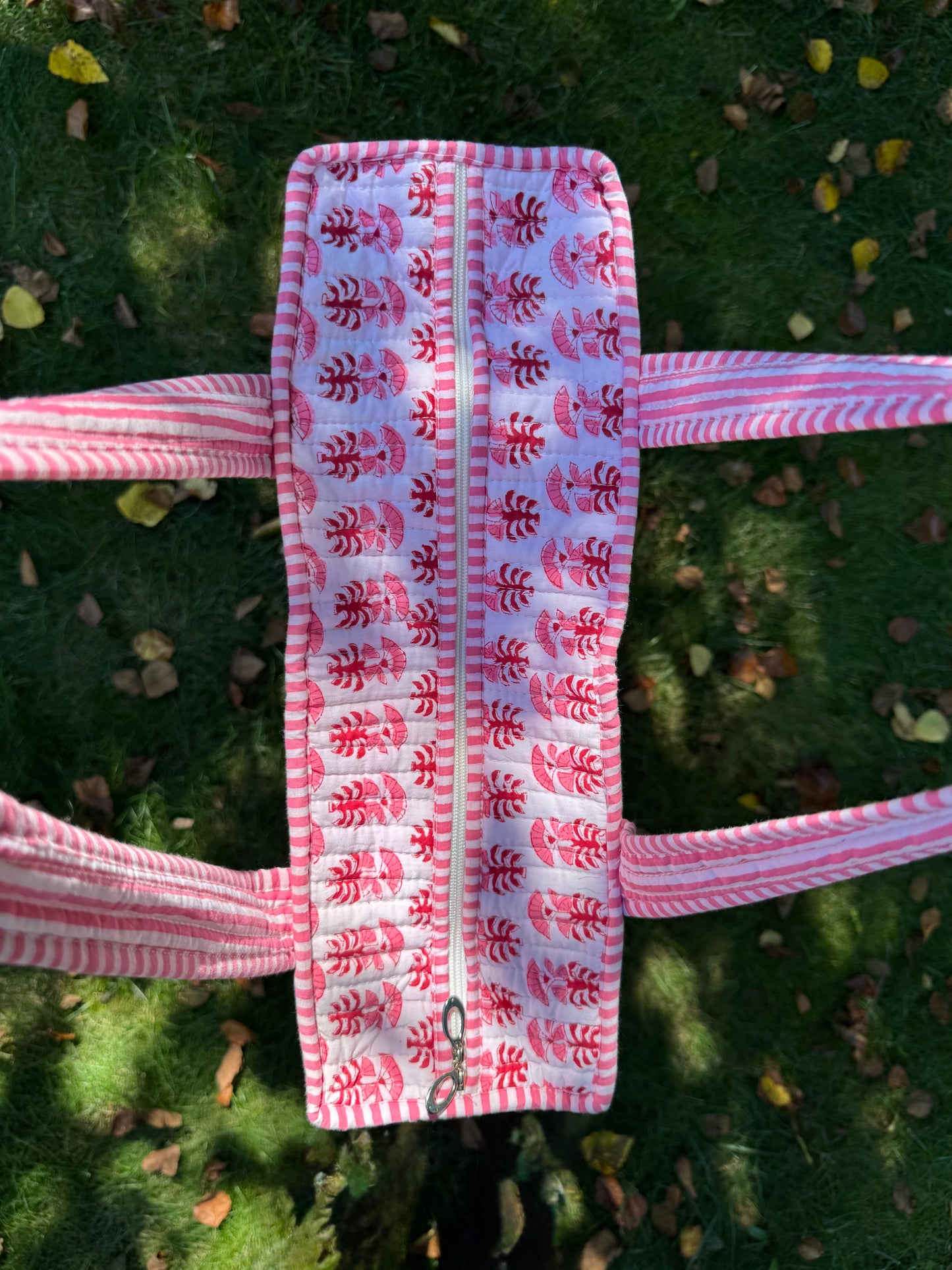 House of Mulmul - Cotton Tote Bag. Pink and white patterned headband on a green grass background