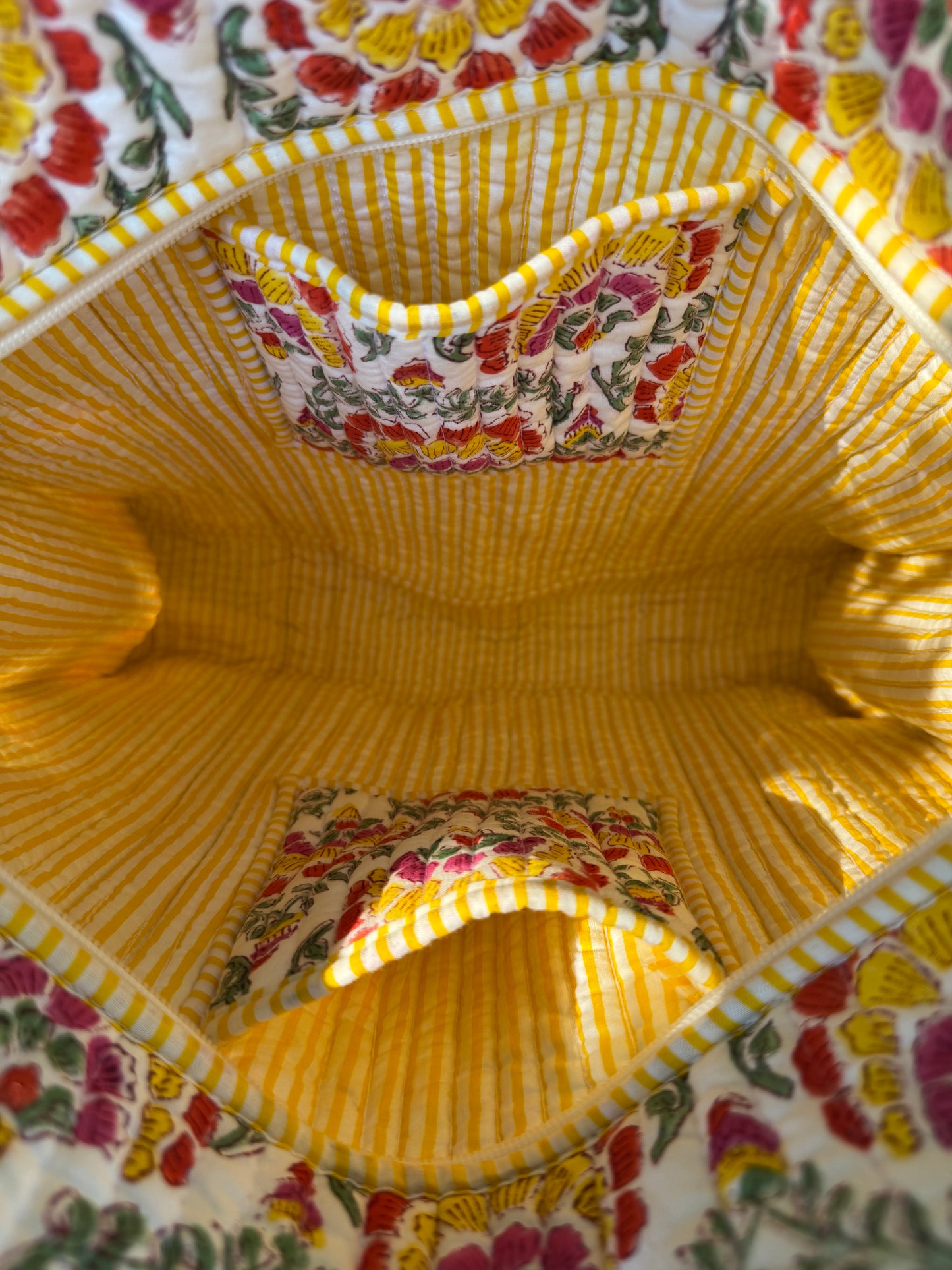 House of Mulmul - Cotton Tote Bag. Close-up of a yellow fabric with floral patterns