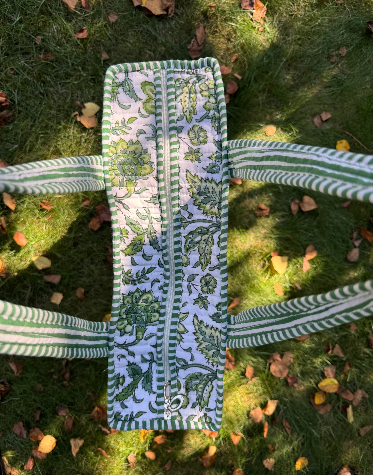 House of Mulmul - Cotton Tote Bag. Green and white patterned bag on grass