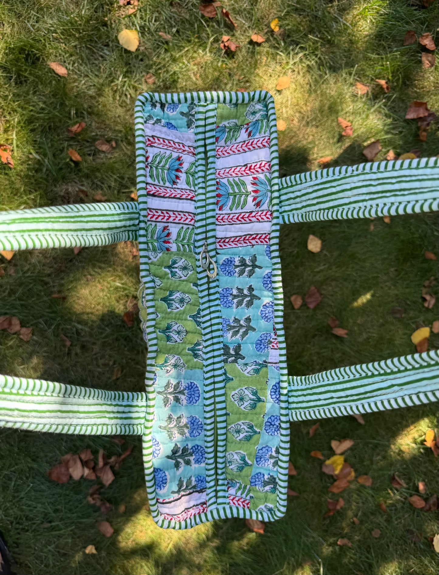 House of Mulmul - Cotton Tote Bag. Decorative fabric strip with floral pattern on a grassy background