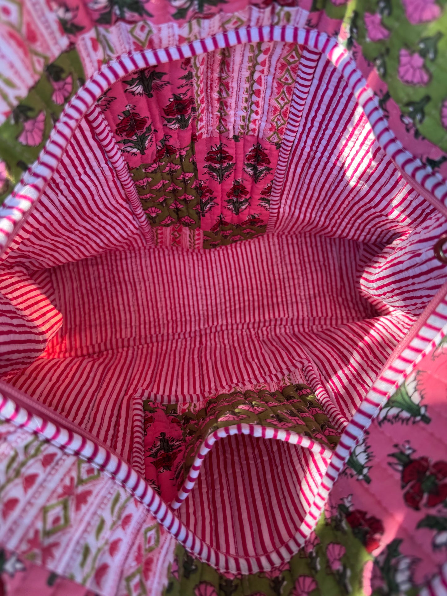 House of Mulmul - Cotton Tote Bag. Close-up of a fabric interior with red and white striped pattern and floral design.