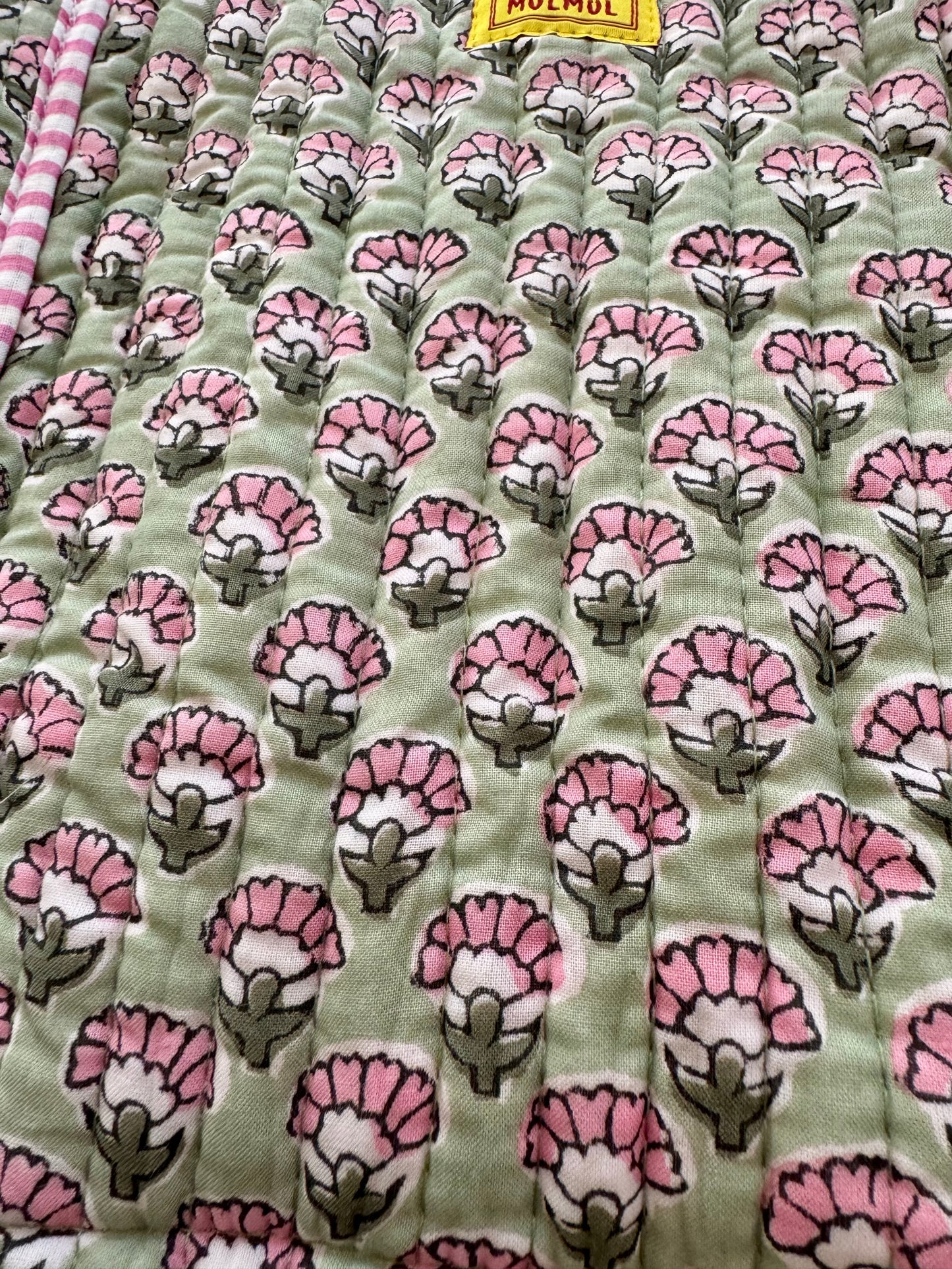 House of Mulmul - Cotton Tote Bag. Floral patterned fabric with pink flowers on a green background