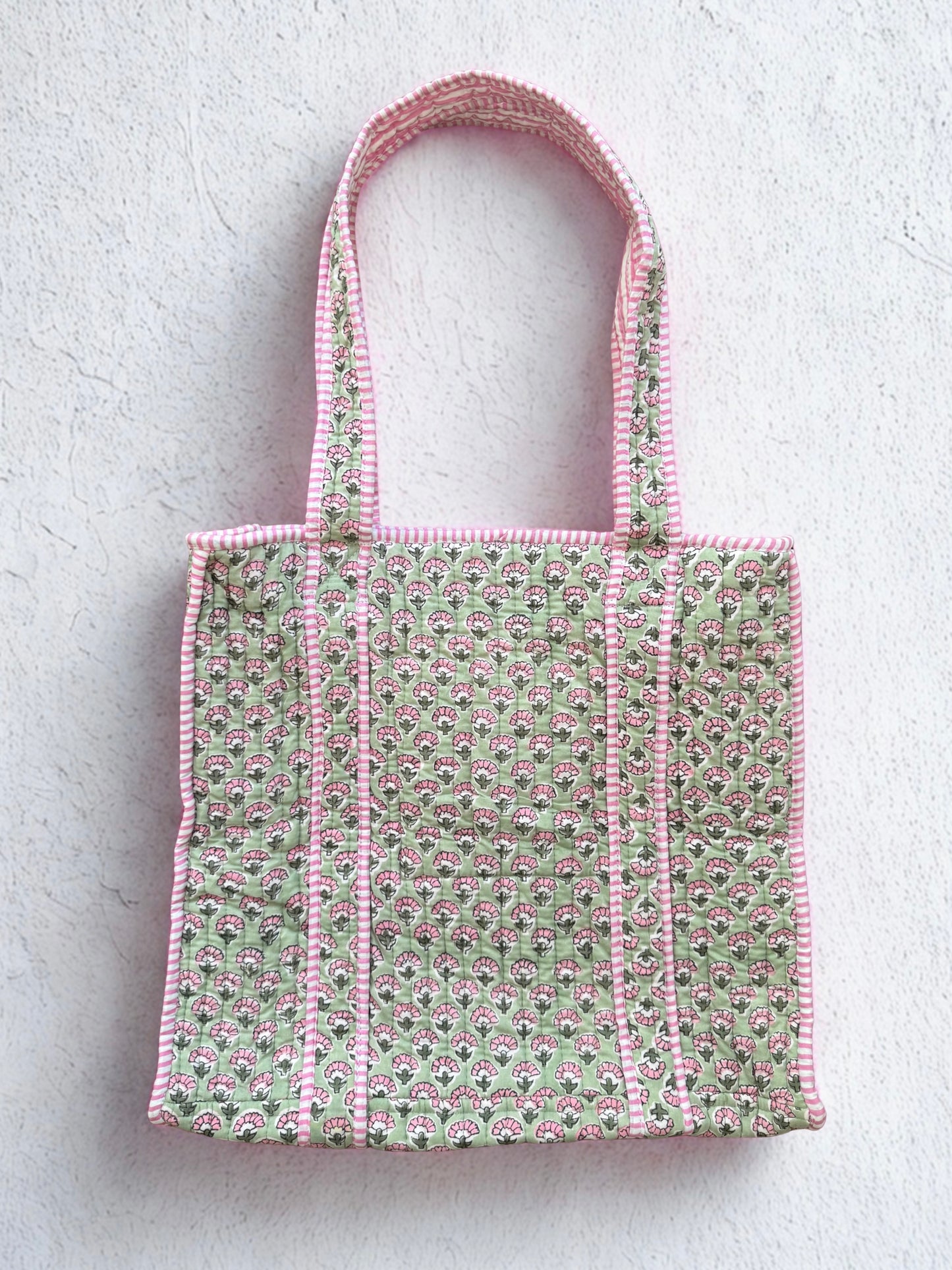 House of Mulmul - Cotton Tote Bag. Tote bag with pink and green pattern on a light gray background