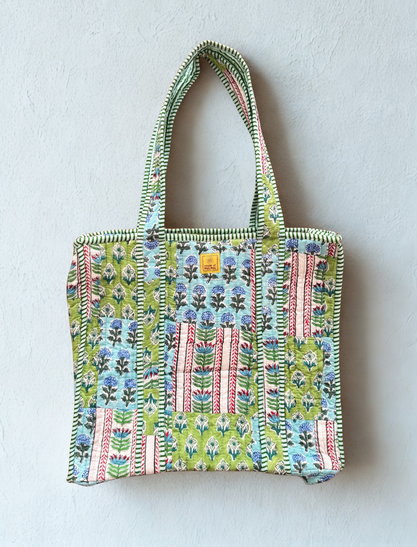 House of Mulmul - Cotton Tote Bag. Colorful patterned tote bag on a light gray background
