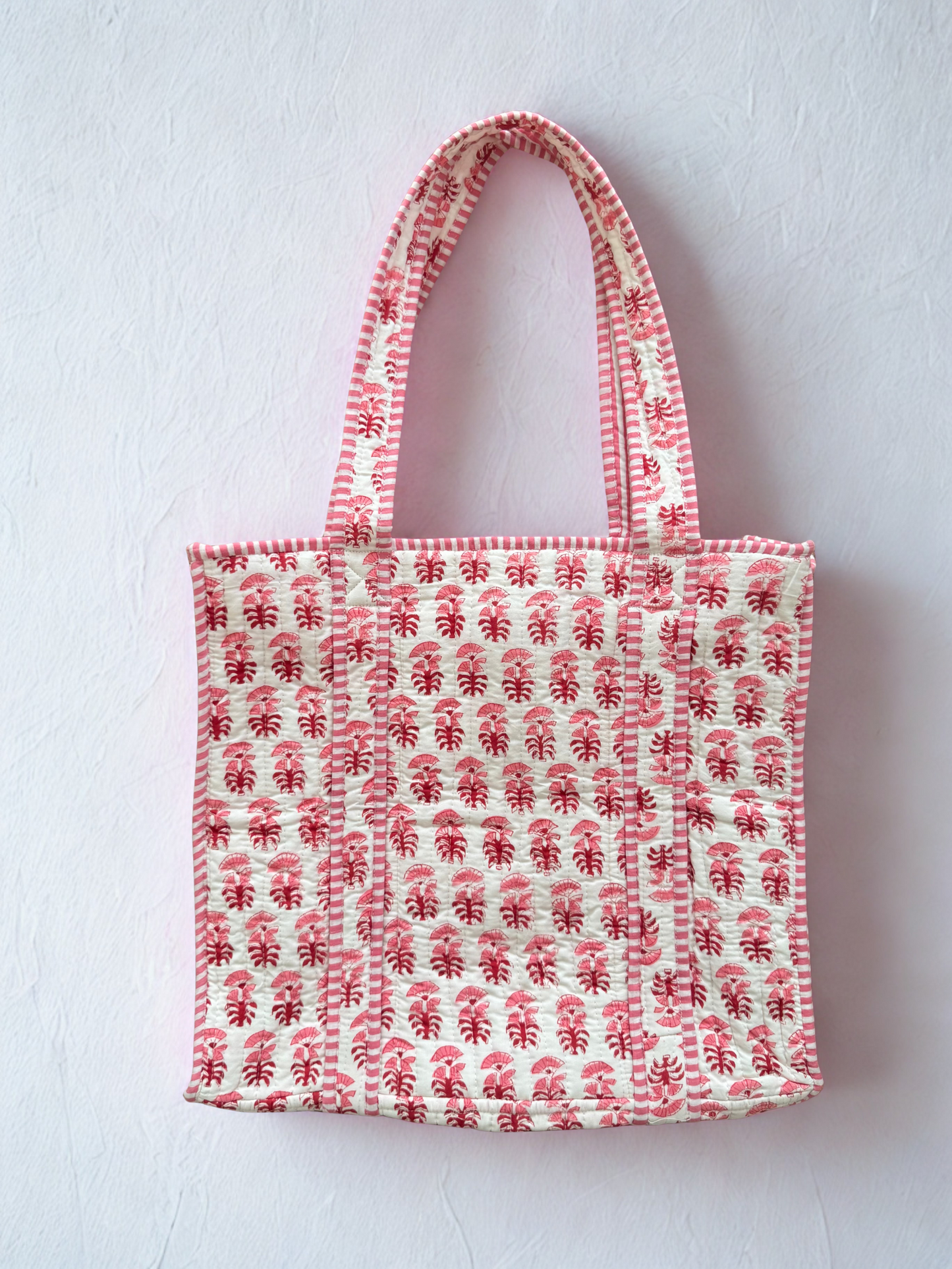 House of Mulmul - Cotton Tote Bag. Tote bag with pink red floral pattern on a white background