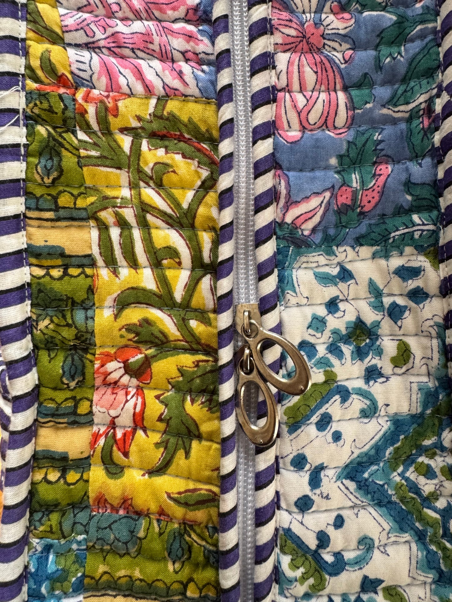 House of Mulmul - Cotton Tote Bag, Travel Bag. Close-up of a quilt with floral and striped patterns