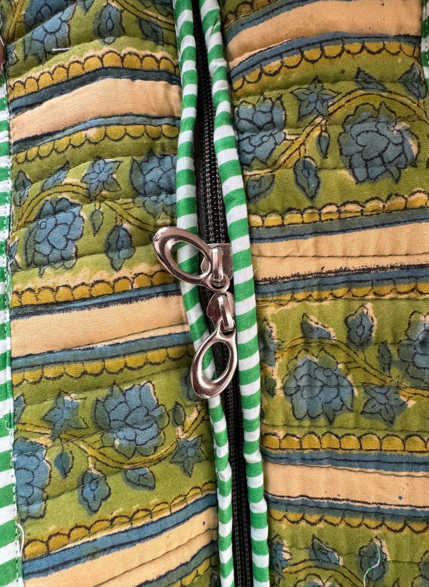 House of Mulmul - Cotton Tote Bag, Travel Bag. Close-up of a patterned fabric with a zipper and clasp.