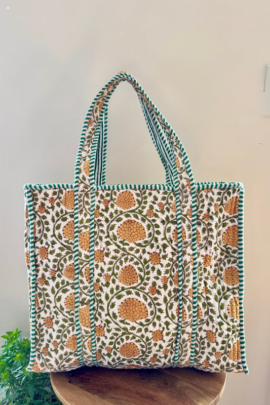 House of Mulmul - Cotton Tote Bag, Travel Bag. Patterned tote bag on a wooden surface with a white background