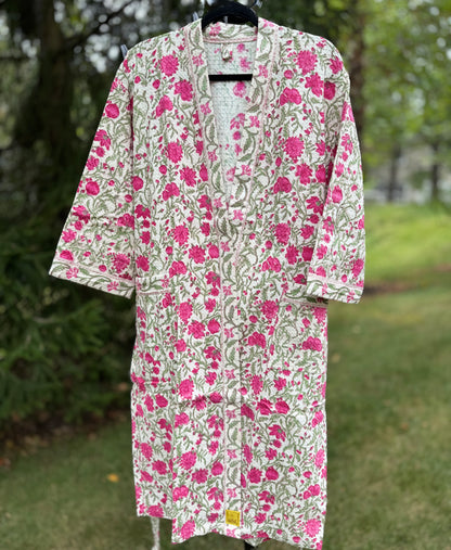 House of Mulmul - cotton bath robe. Floral patterned robe with pink flowers on a green background.
