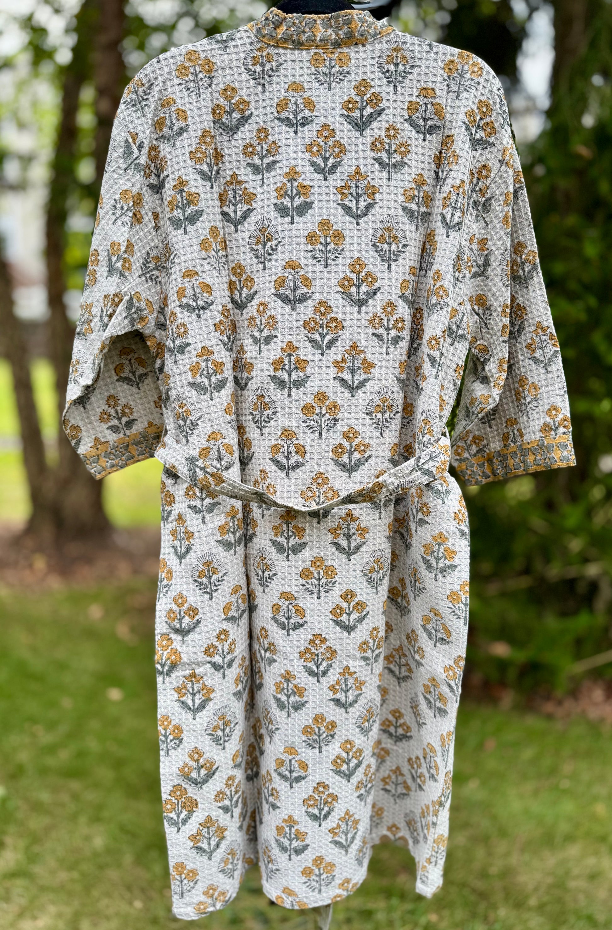 House of Mulmul - cotton bath robe. Floral gray patterned robe with yellow flowers on a green background.