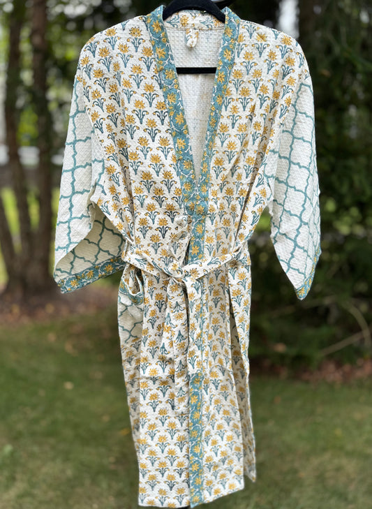 House of Mulmul - cotton bath robe. Floral and geometric patterned robe with yellow flowers and teal blue colors.