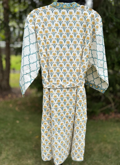 House of Mulmul - cotton bath robe. Floral and geometric patterned robe with yellow flowers and teal blue colors.