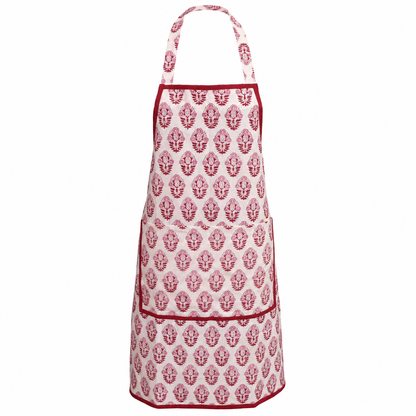 House of Mulmul - Blockprint Cotton Apron. A white apron with a repeating red floral block print pattern and red trim, featuring a neck strap and two front pockets, shown against a plain white background.