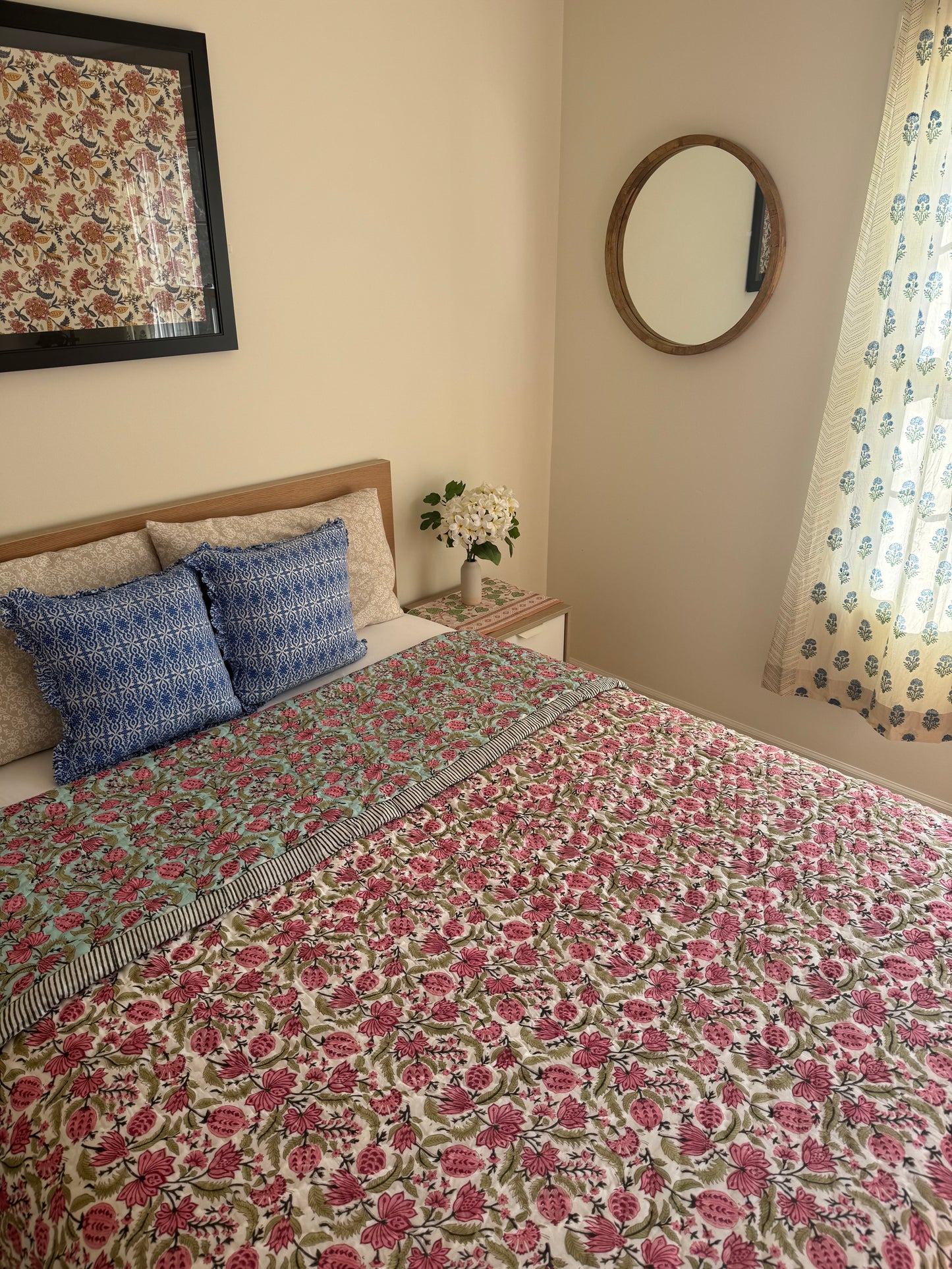 House of Mulmul - Blockprinted Cotton Quilt. Reversible Quilt. Bedroom with floral hand blockprinted bedspread cotton quilt, pillows, and decorative elements.