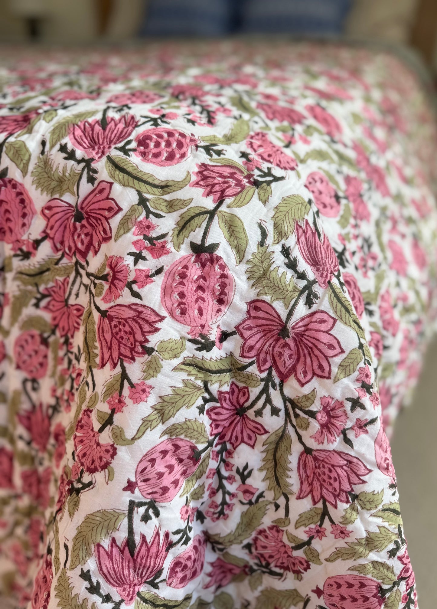 House of Mulmul - Blockprinted Cotton Quilt. Reversible Quilt. Bedroom with floral hand blockprinted bedspread cotton quilt, pillows, and decorative elements.