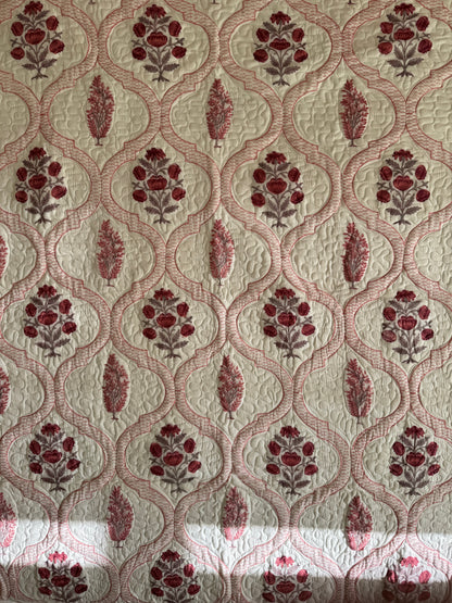 House of Mulmul - Blockprinted Cotton Bedcover Reversible Muslin. Patterned bedcover with red floral design on a beige background