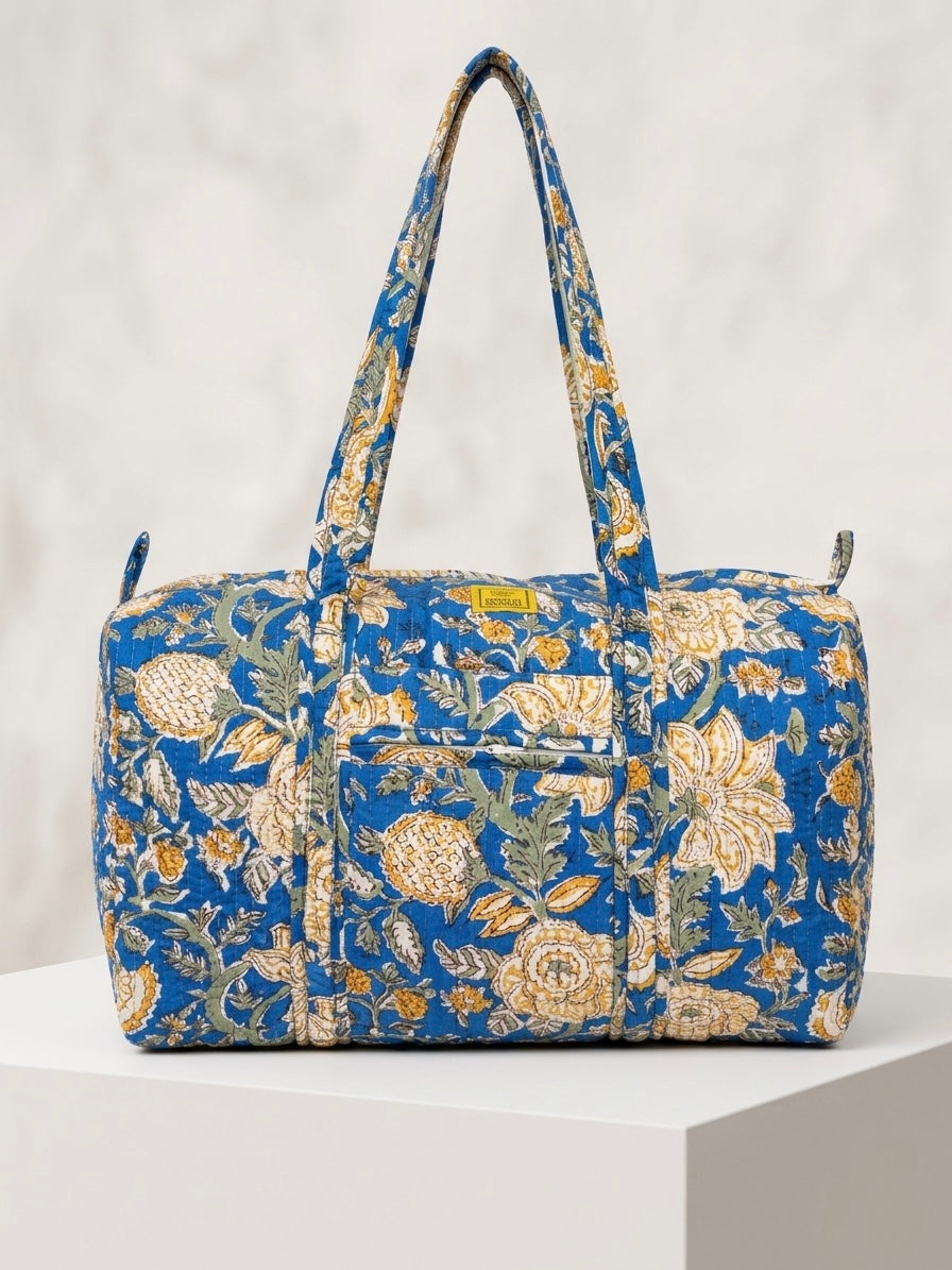 House of Mulmul - Blockprinted Cotton Duffle Bag Weekender Bag. Blue floral patterned bag on a white background