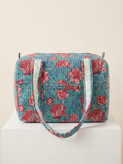 House of Mulmul - Blockprinted Cotton Duffle Bag Weekender Bag. Floral patterned duffle bag on a white background.