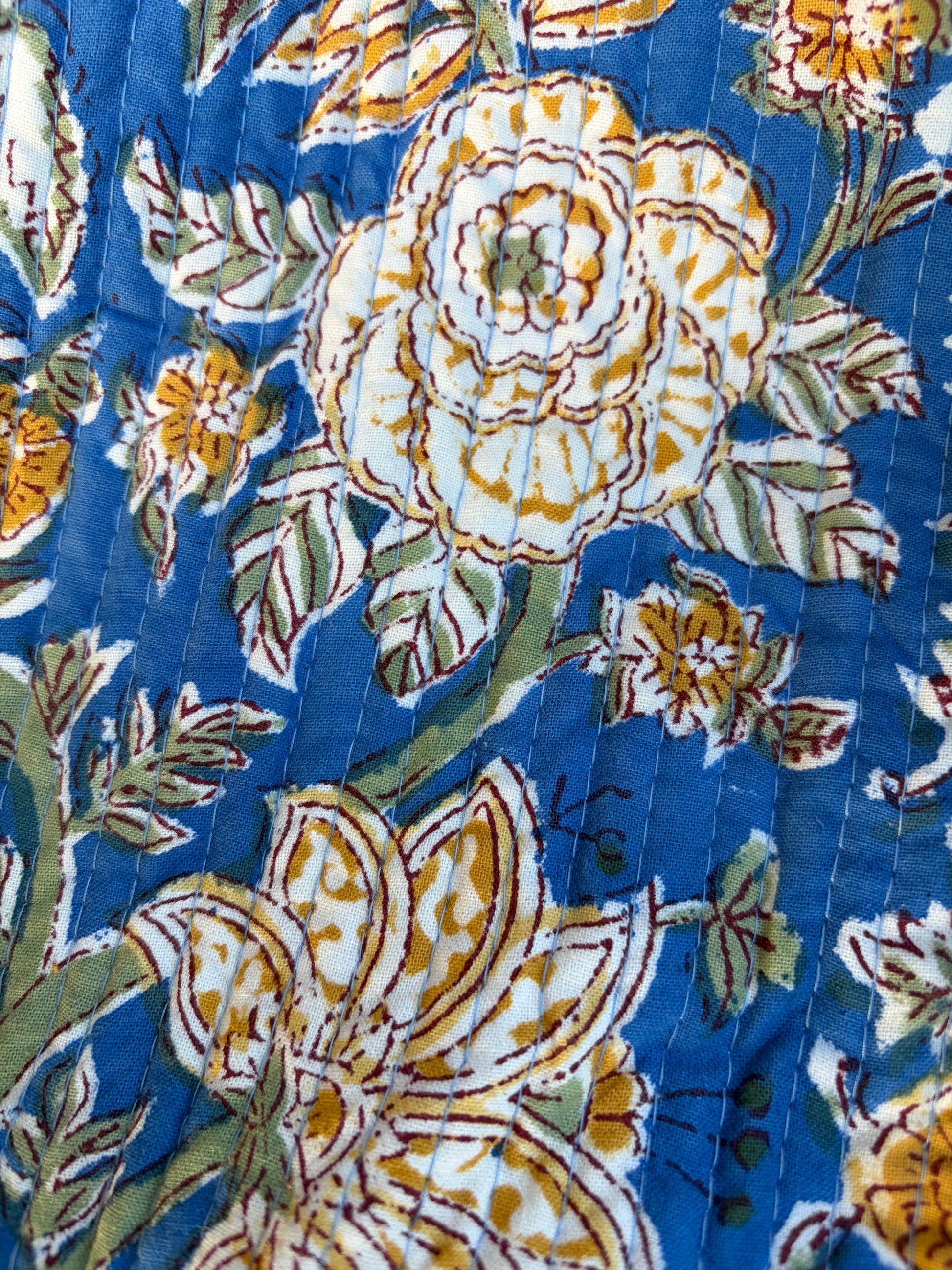 House of Mulmul - Blockprinted Cotton Duffle Bag Weekender Bag. Close-up of floral fabric with blue background
