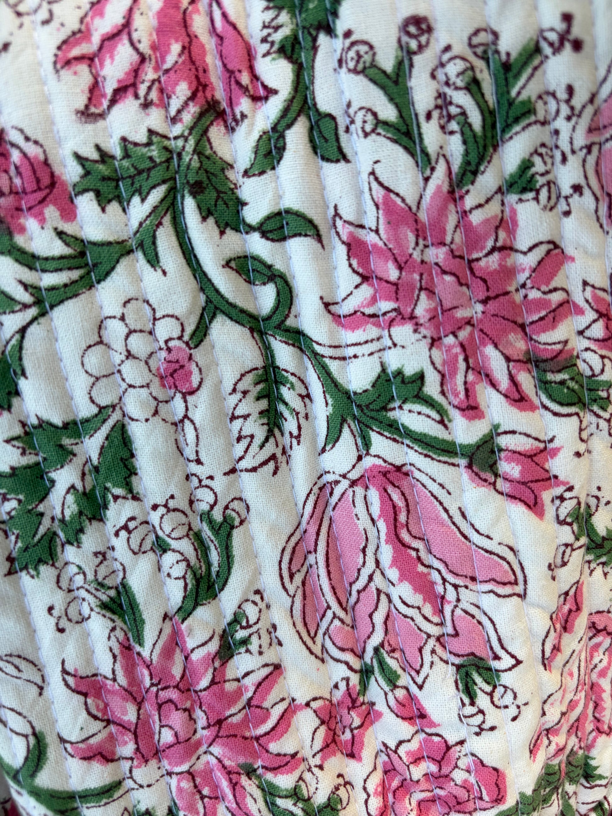 House of Mulmul - Blockprinted Cotton Duffle Bag Weekender Bag. Floral patterned fabric with pink flowers and green leaves on a white background