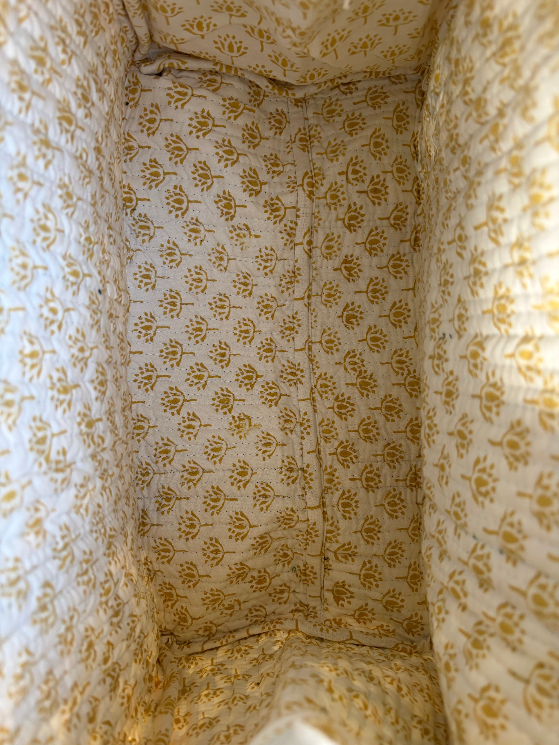 House of Mulmul - Blockprinted Cotton Duffle Bag Weekender Bag. Inside of the bag with patterned fabric in yellow floral design