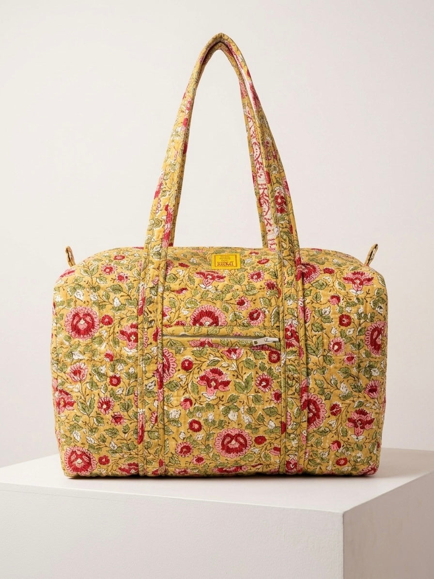 House of Mulmul - Blockprinted Cotton Duffle Bag Weekender Bag. Floral patterned handbag on a white background