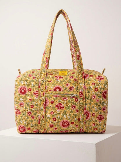 House of Mulmul - Blockprinted Cotton Duffle Bag Weekender Bag. Floral patterned handbag on a white background