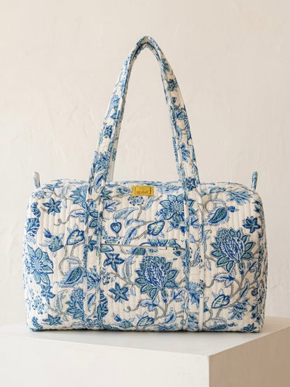 House of Mulmul - Blockprinted Cotton Duffle Bag Weekender Bag. Blue floral patterned bag on a white background