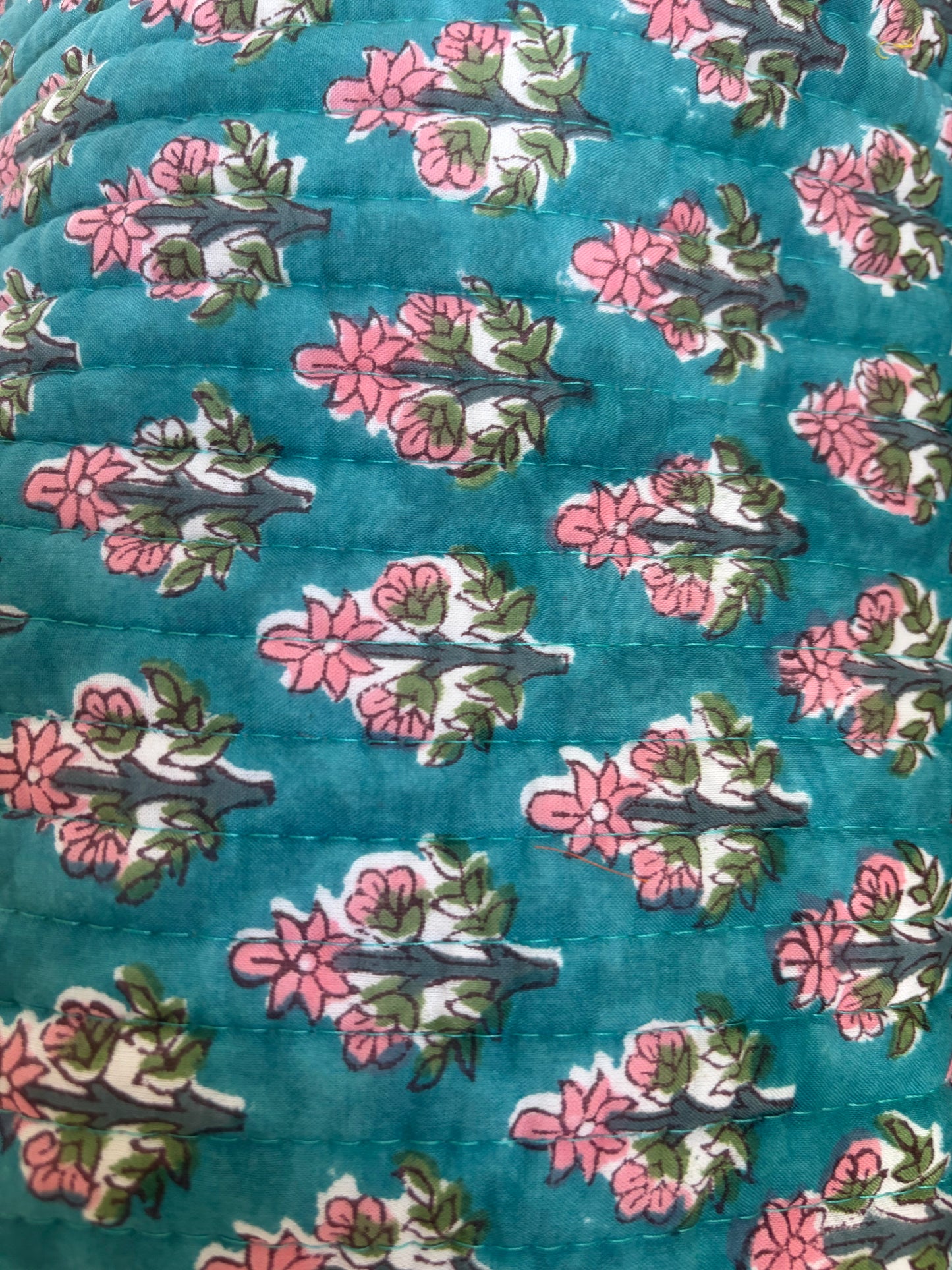 House of Mulmul - Blockprinted Cotton Hair Tool Bag. Close-up of hair tool bag with floral pattern on a blue background