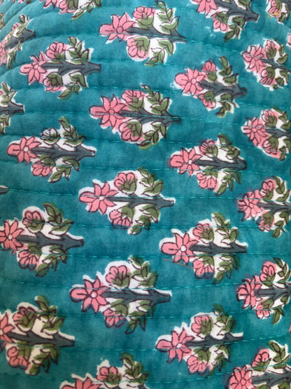 House of Mulmul - Blockprinted Cotton Hair Tool Bag. Close-up of hair tool bag with floral pattern on a blue background