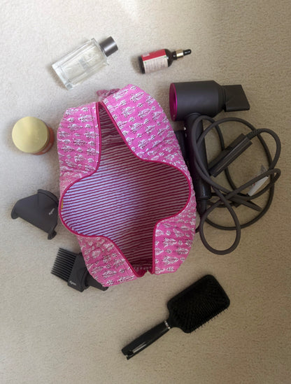 House of Mulmul - Blockprinted Cotton Hair Tool Bag.  Dyson hair dryer straightener kit pink cover with hair care products on a beige surface