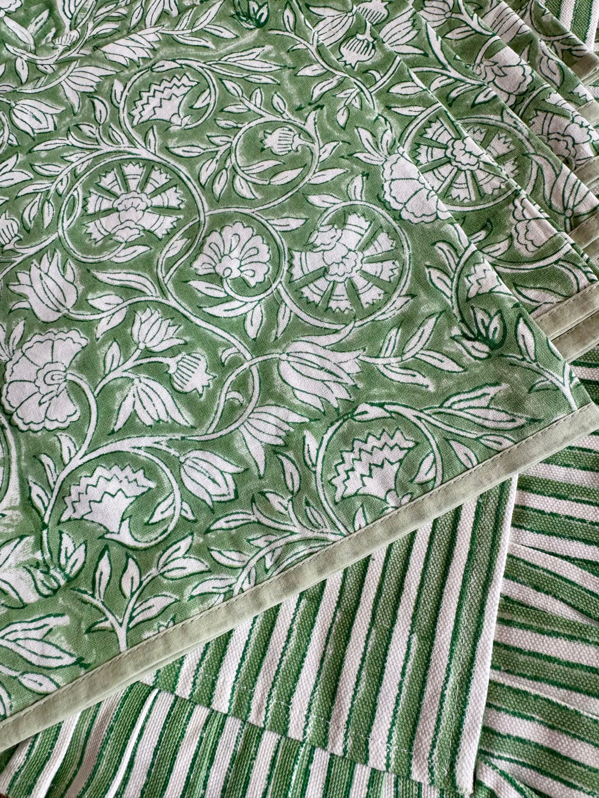 House of Mulmul - Blockprinted Cotton Placemats and Napkins. Green napkins with white floral pattern and striped border