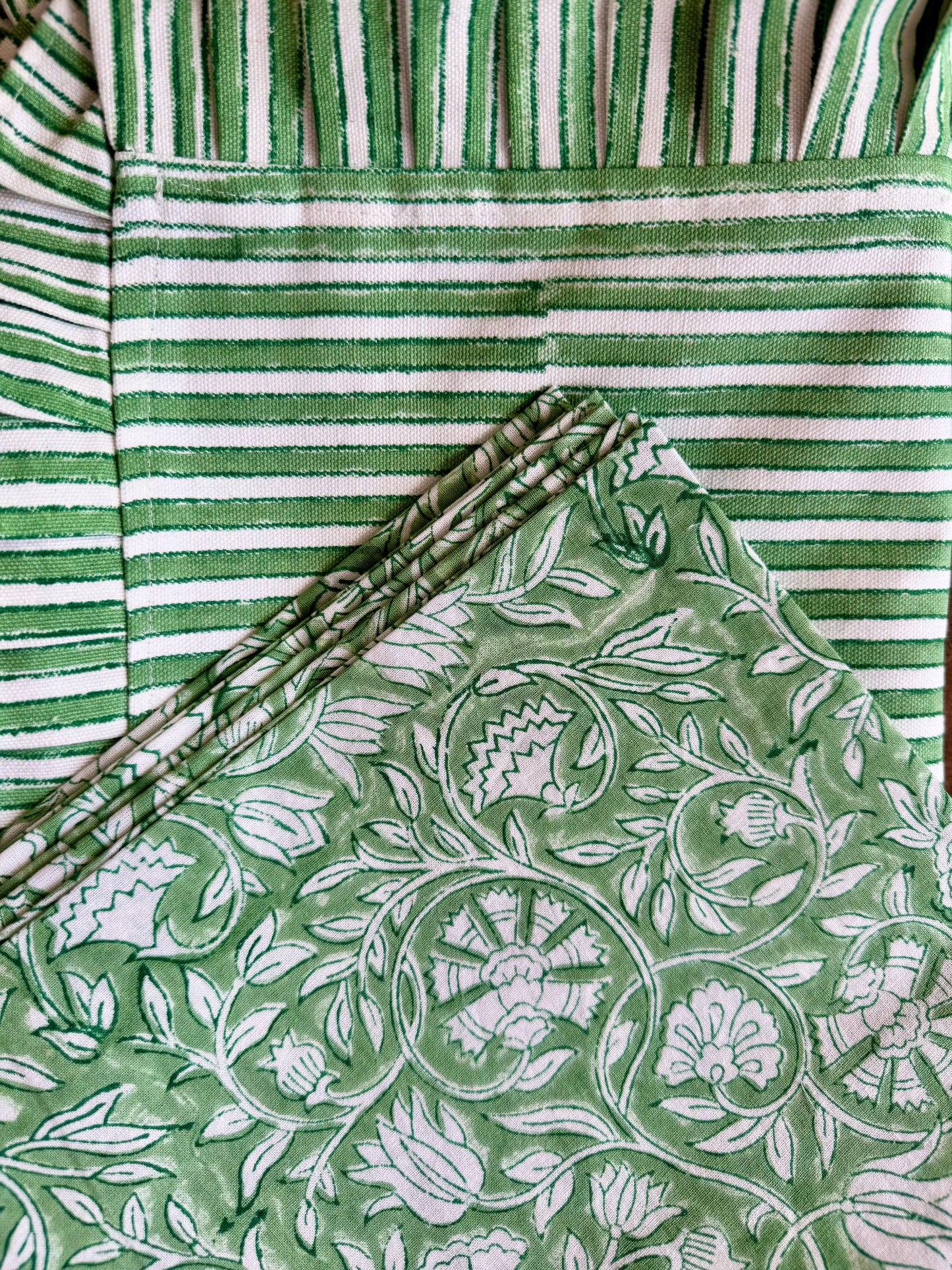 House of Mulmul - Blockprinted Cotton Placemats and Napkins. Green and white striped mats and napkins with a floral patterned fabric