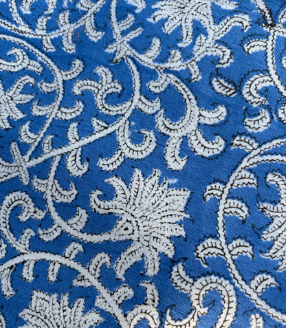 House of Mulmul - Blockprinted Cotton Table Napkins. Close-up of a blue fabric with white floral embroidery