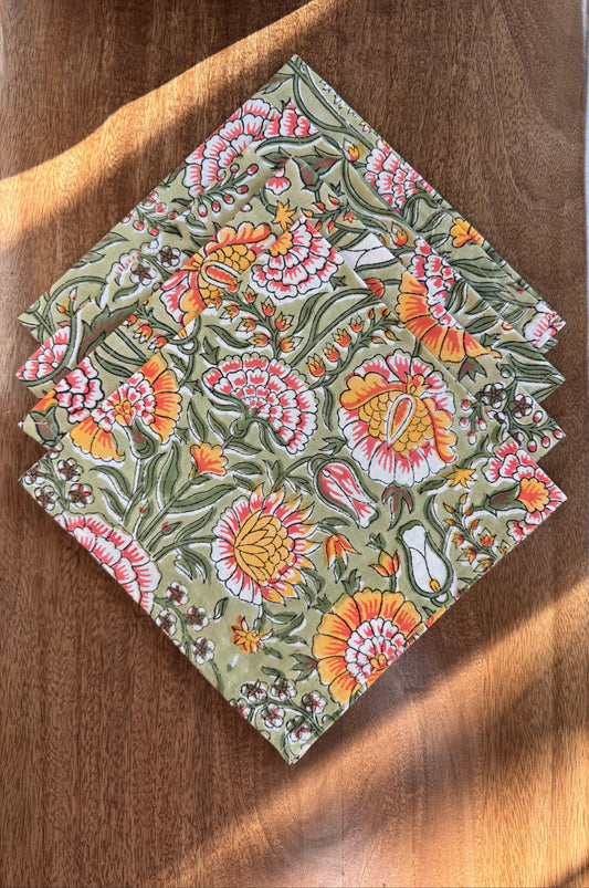 House of Mulmul - Blockprinted Cotton Napkins. Floral patterned napkins on a wooden surface