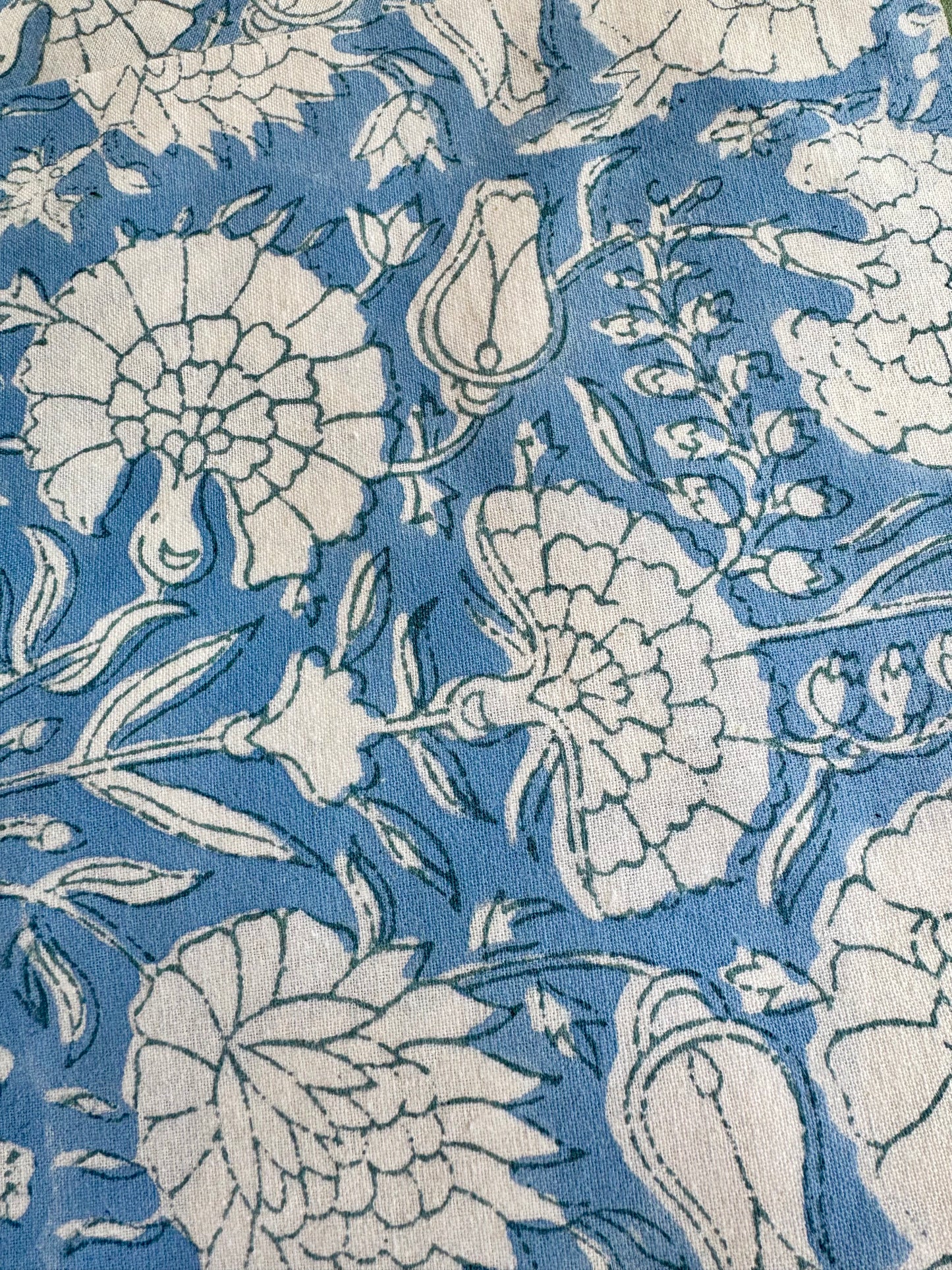 House of Mulmul - Blockprinted Cotton Napkins. Floral pattern napkins with white flowers on a blue background