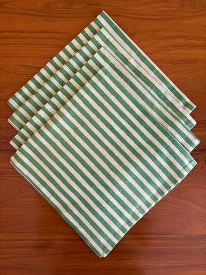 House of Mulmul - Blockprinted Cotton Table Napkins. Green and white striped table napkins on a wooden surface