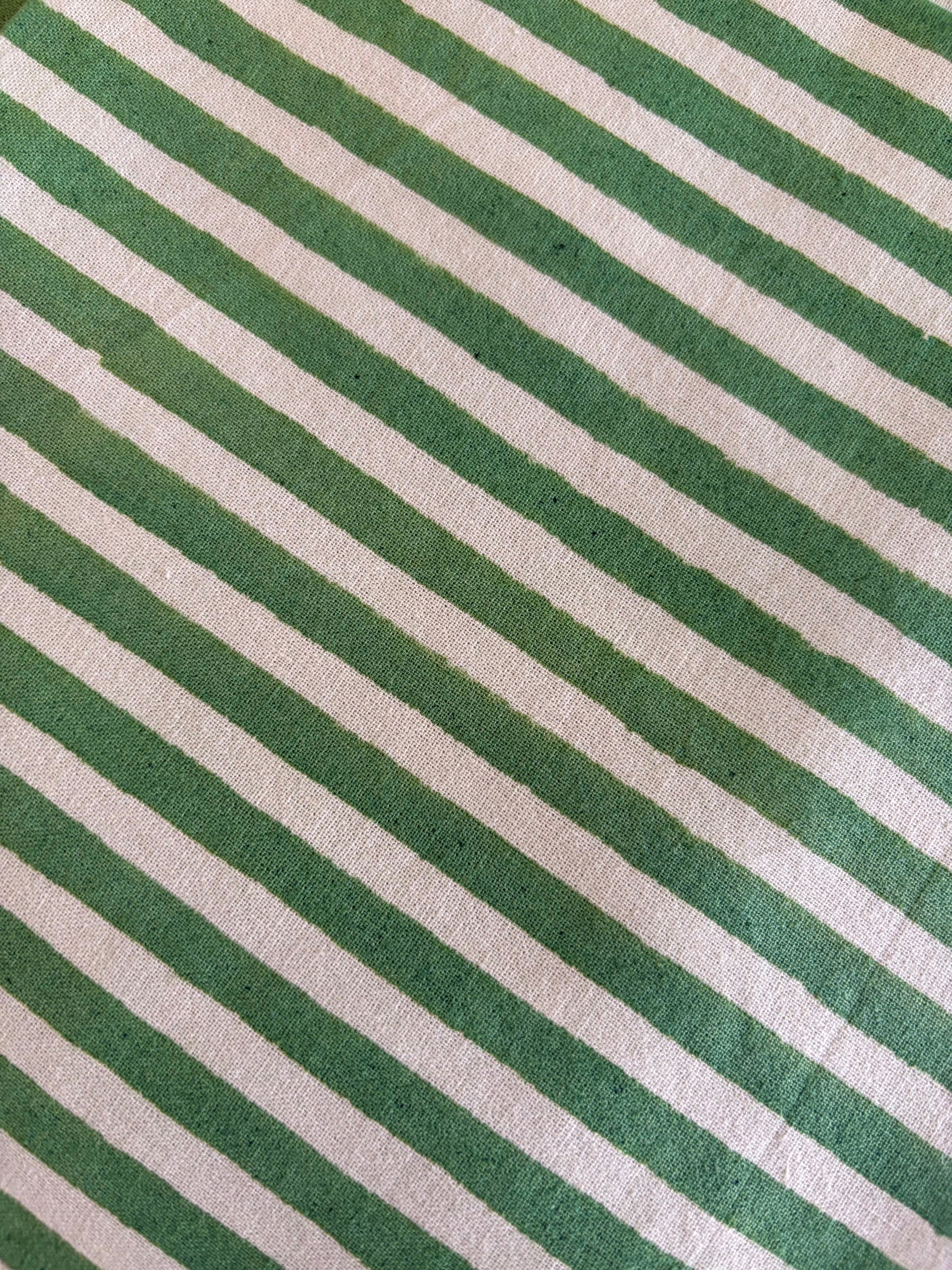 House of Mulmul - Blockprinted Cotton Table Napkins. Close-up of green and white striped fabric