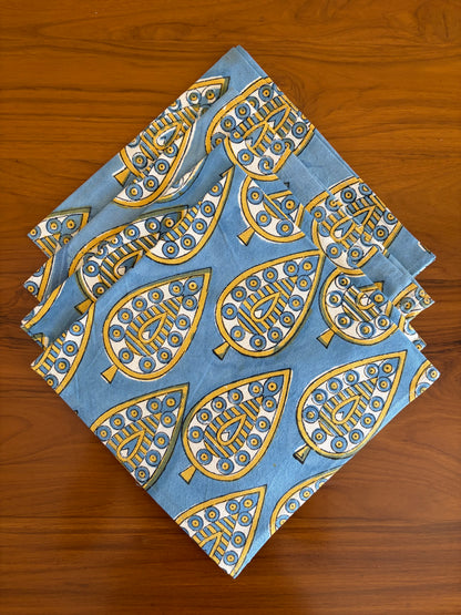 House of Mulmul - Blockprinted Cotton Table Napkins. Set of blue napkins with gold leaf patterns on a wooden surface
