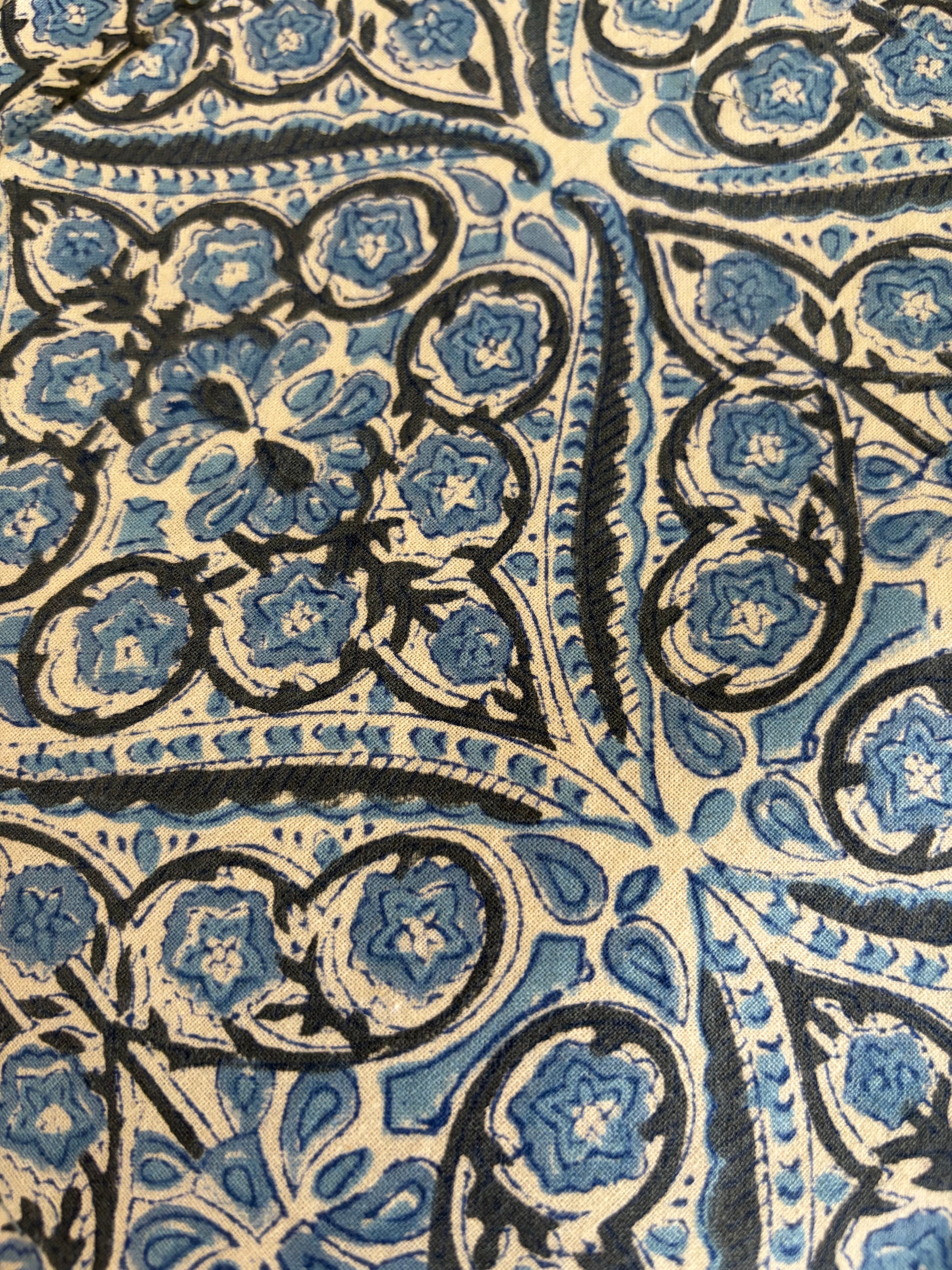 House of Mulmul - Blockprinted Cotton Table Napkins. Close-up of intricate blue and black floral pattern on fabric