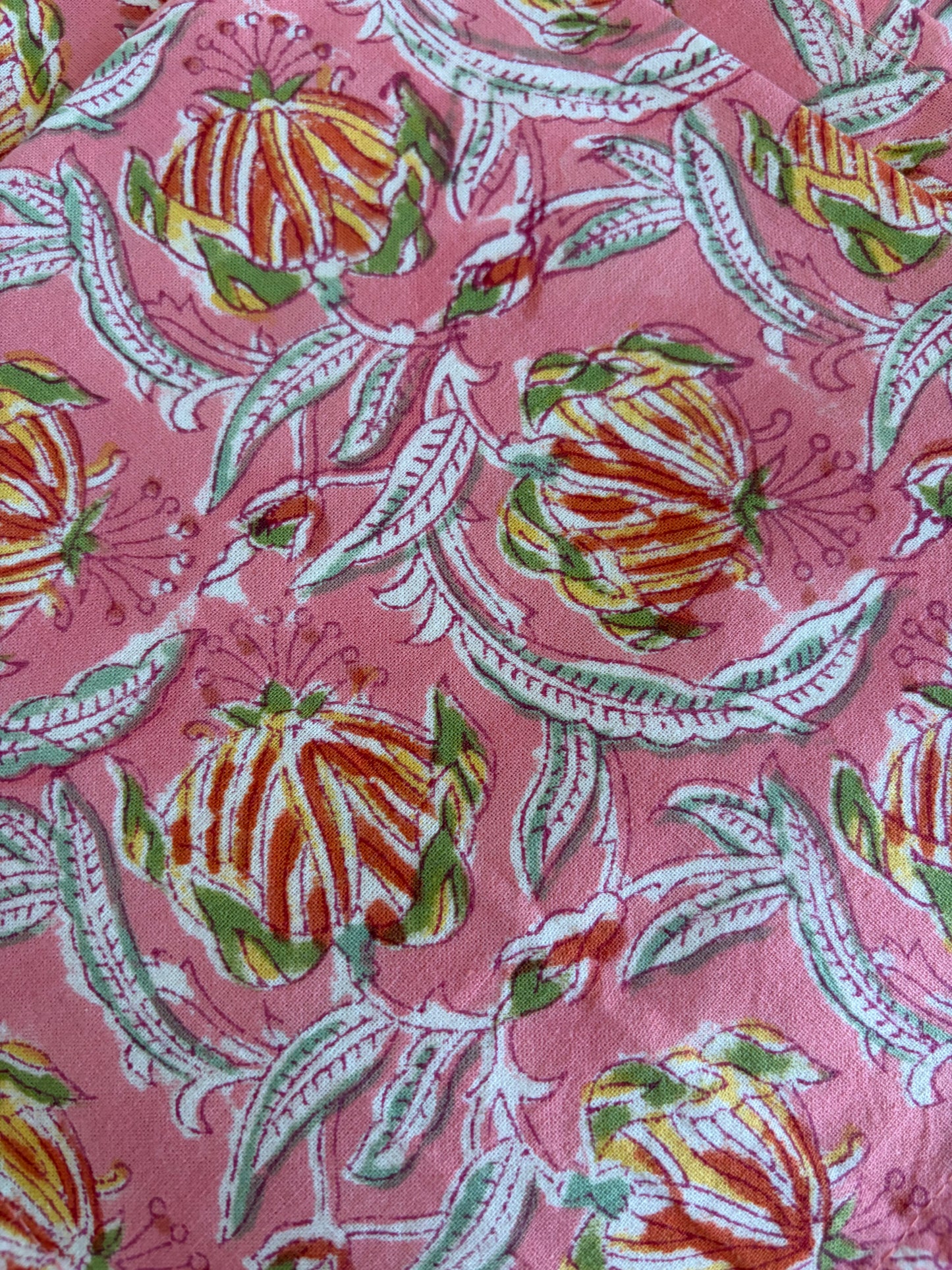 House of Mulmul - Blockprinted Cotton Table Napkins. Floral patterned fabric with colorful flowers on a pink background